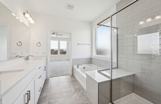 4376 Noble Ln, Midlothian, TX 76065 - full bathroom featuring ceiling fan, a bath, a stall shower, double vanity, and tile patterned floors