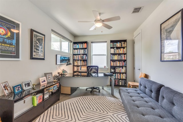 office featuring visible vents and ceiling fan