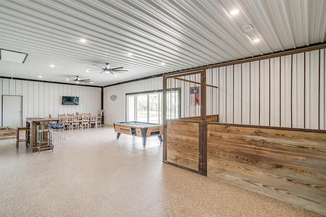 recreation room with metal wall, speckled floor, a ceiling fan, and billiards
