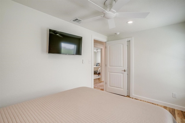 unfurnished bedroom with visible vents, baseboards, ceiling fan, wood finished floors, and recessed lighting