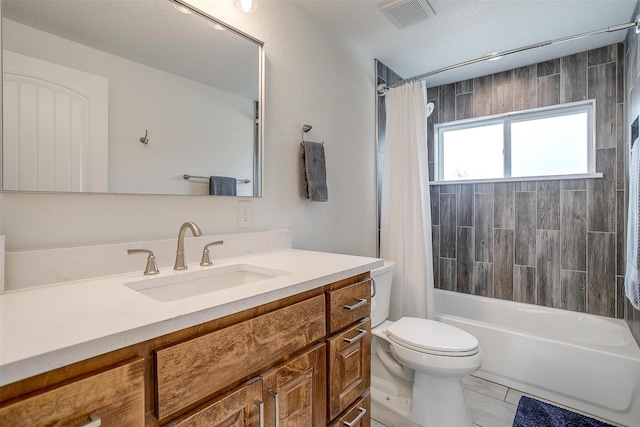 full bath featuring shower / bath combo, visible vents, toilet, and vanity