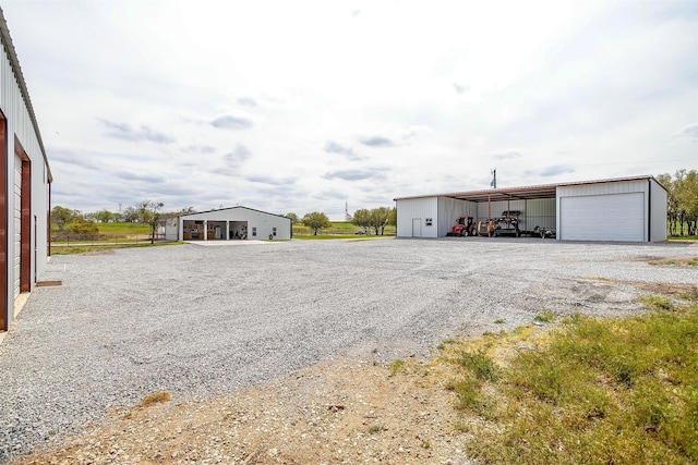 view of pole building featuring gravel driveway