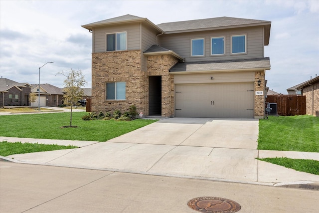 5228 Star Bright Dr, Fort Worth, TX 76179 - view of front of home with concrete driveway, fence, an attached garage, central AC unit, and a front lawn
