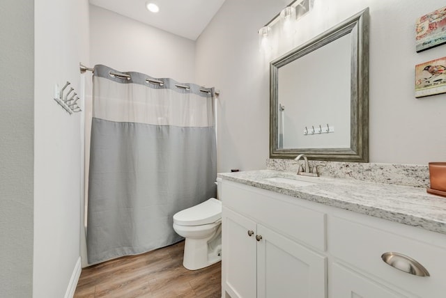 199 Pearl Valley Dr, Kerens, TX 75144 - full bath featuring toilet, vanity, a shower with shower curtain, and wood finished floors