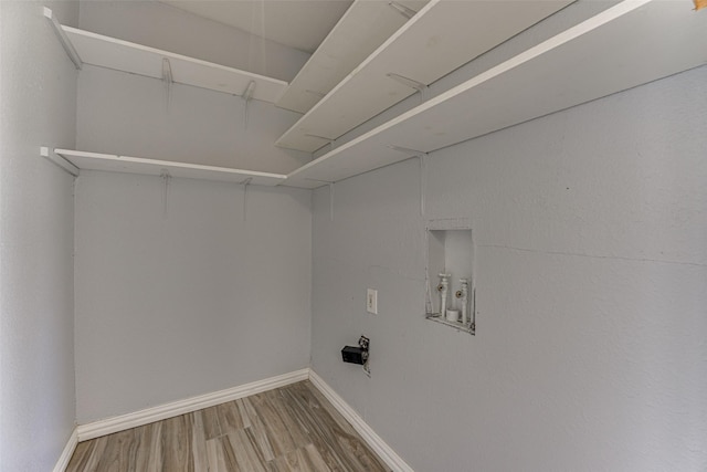 1805 Austin Dr, Kaufman, TX 75142 - clothes washing area with laundry area, baseboards, hookup for a washing machine, and wood finished floors
