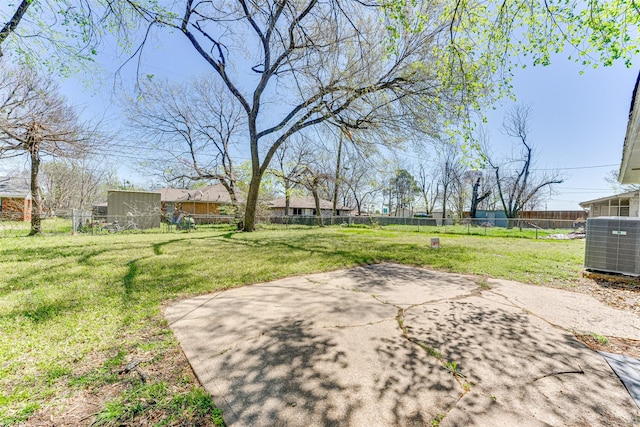1805 Austin Dr, Kaufman, TX 75142 - view of yard with a fenced backyard, a patio area, and central AC
