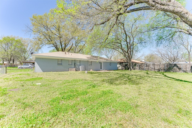 1805 Austin Dr, Kaufman, TX 75142 - view of yard featuring central AC unit and a fenced backyard