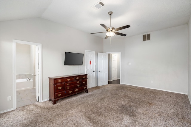 unfurnished bedroom featuring vaulted ceiling, baseboards, carpet flooring, and visible vents