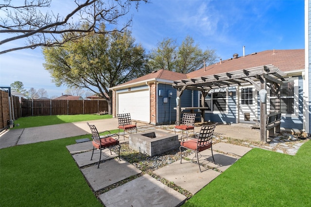 exterior space featuring an attached garage, fence, a pergola, a lawn, and an outdoor fire pit