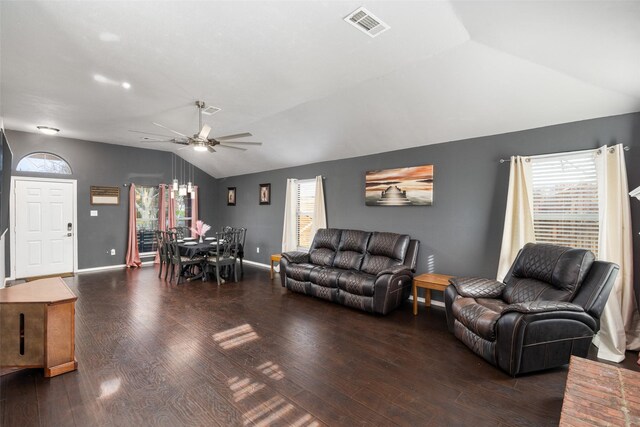 living area with visible vents, wood finished floors, lofted ceiling, plenty of natural light, and a ceiling fan