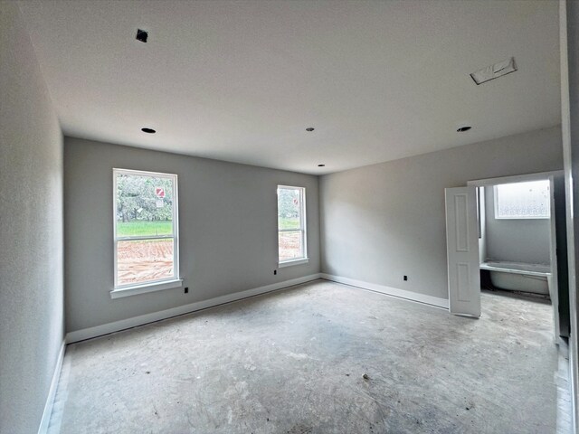 1005 Ronnie Ct, Springtown, TX 76082 - empty room featuring baseboards and healthy amount of natural light