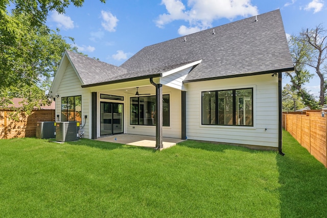 4513 Lakecrest Dr, The Colony, TX 75056 - back of property featuring a shingled roof, a patio, a ceiling fan, and central AC