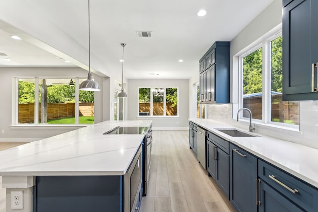 4513 Lakecrest Dr, The Colony, TX 75056 - kitchen featuring a sink, appliances with stainless steel finishes, light wood finished floors, baseboards, and recessed lighting