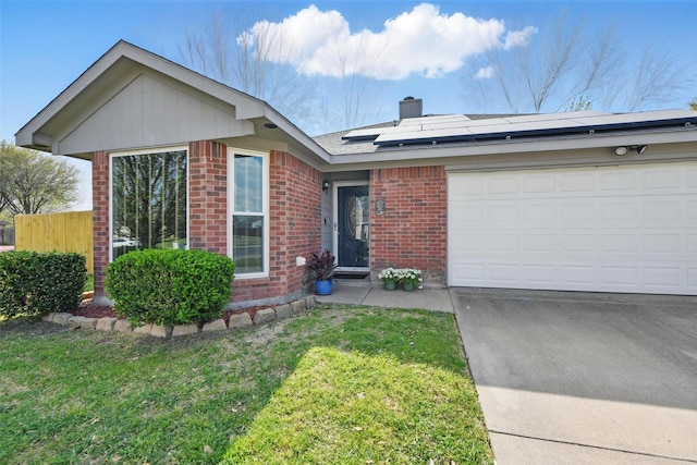 1008 Miles Ave, Burleson, TX 76028 - ranch-style home with brick siding, a chimney, roof mounted solar panels, and a front lawn