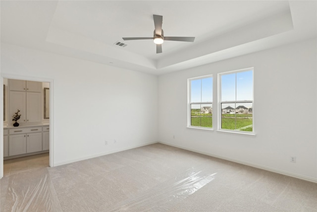 15742 Millwood Trl, Frisco, TX 75033 - spare room featuring light colored carpet, visible vents, and a raised ceiling