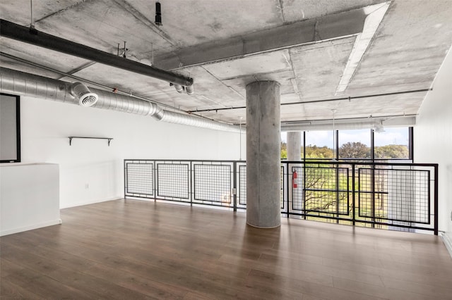 below grade area featuring visible vents, baseboards, and wood finished floors