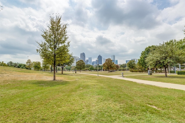 view of home's community featuring a yard and a city view