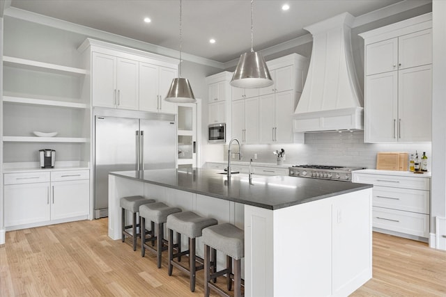 909 Saint Anne Ct, Heath, TX 75032 - kitchen with built in appliances, custom range hood, ornamental molding, a sink, and dark countertops