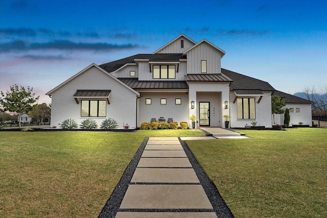 909 Saint Anne Ct, Heath, TX 75032 - view of front of home featuring a standing seam roof, a yard, board and batten siding, metal roof, and a shingled roof