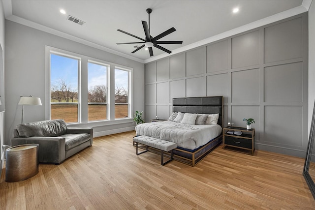 909 Saint Anne Ct, Heath, TX 75032 - bedroom with a decorative wall, crown molding, light wood finished floors, a ceiling fan, and recessed lighting