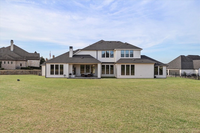 909 Saint Anne Ct, Heath, TX 75032 - back of property with a patio area and roof with shingles