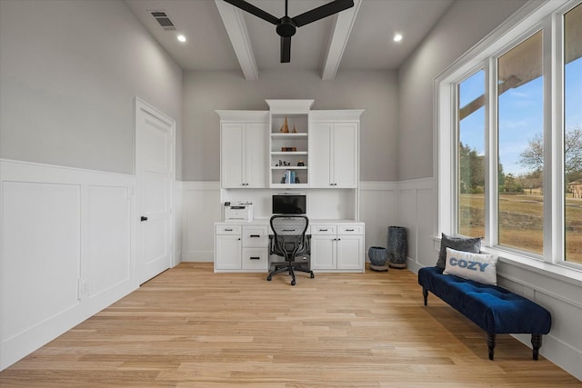 909 Saint Anne Ct, Heath, TX 75032 - office area with beamed ceiling, light wood-style flooring, a ceiling fan, a decorative wall, and wainscoting
