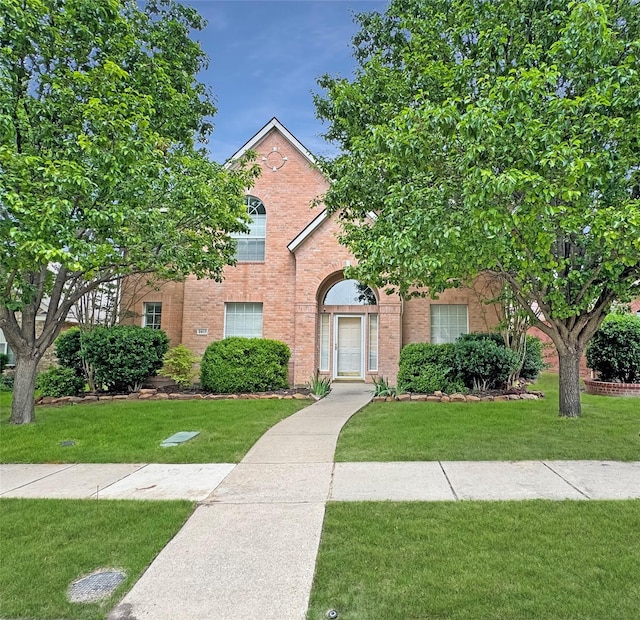3917 Iris Ct, Mckinney, TX 75070 - view of front of property with brick siding and a front yard