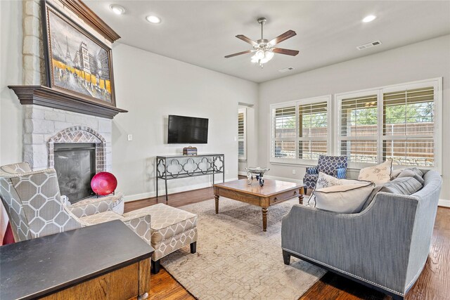 1630 Old Oak Ct, Prosper, TX 75078 - living area featuring ceiling fan, wood finished floors, a stone fireplace, and recessed lighting