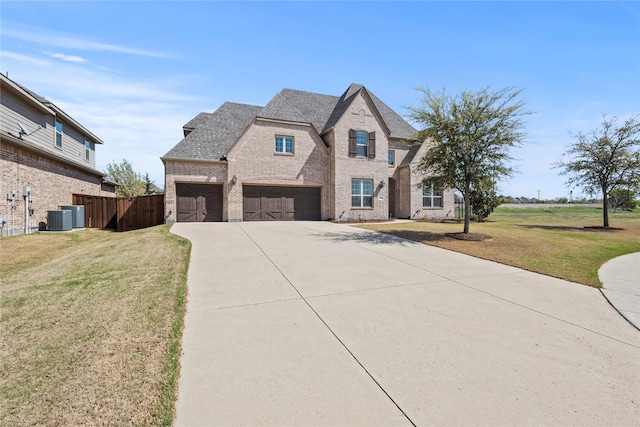 1630 Old Oak Ct, Prosper, TX 75078 - french provincial home with brick siding, driveway, an attached garage, and a shingled roof