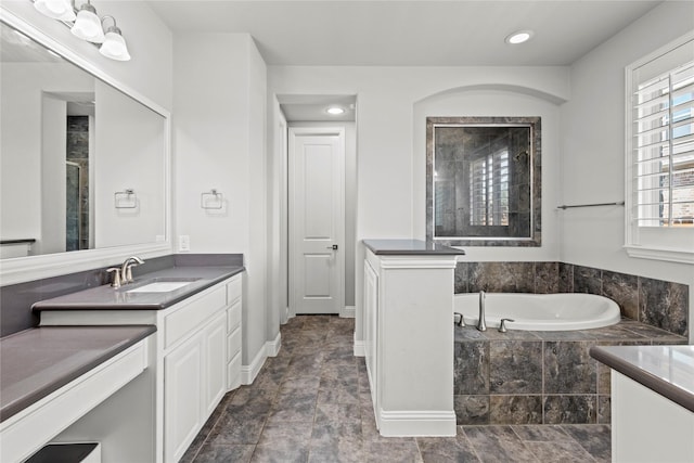 1630 Old Oak Ct, Prosper, TX 75078 - bathroom with vanity, tiled shower, a garden tub, and recessed lighting