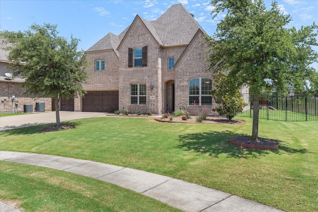 1630 Old Oak Ct, Prosper, TX 75078 - french country style house with brick siding, an attached garage, and concrete driveway