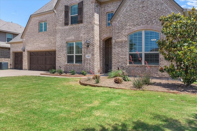 1630 Old Oak Ct, Prosper, TX 75078 - french country inspired facade featuring brick siding, a front lawn, and driveway