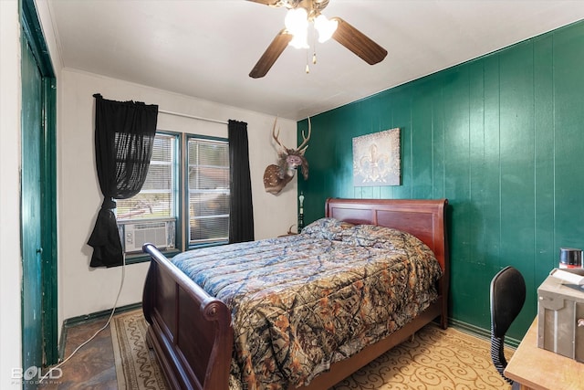 bedroom featuring cooling unit and a ceiling fan