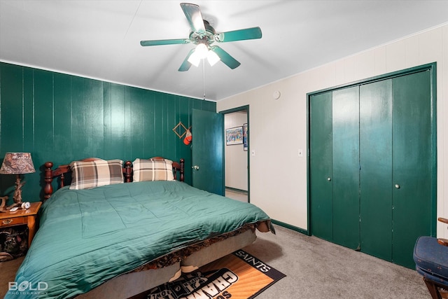carpeted bedroom featuring a closet and a ceiling fan