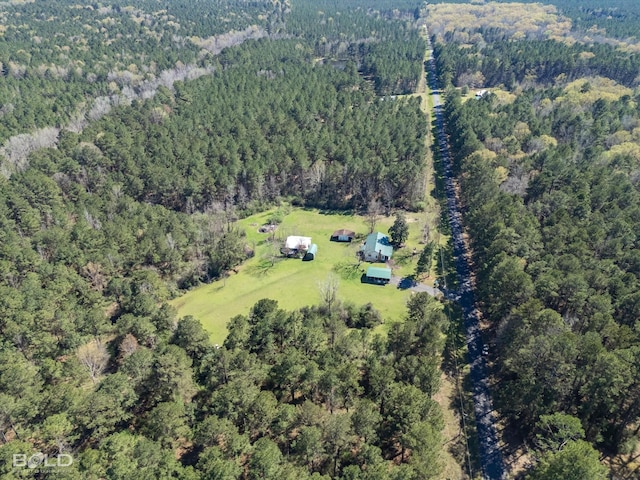 aerial view featuring a view of trees