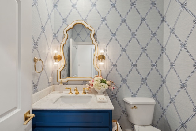bathroom featuring tile walls, toilet, and vanity
