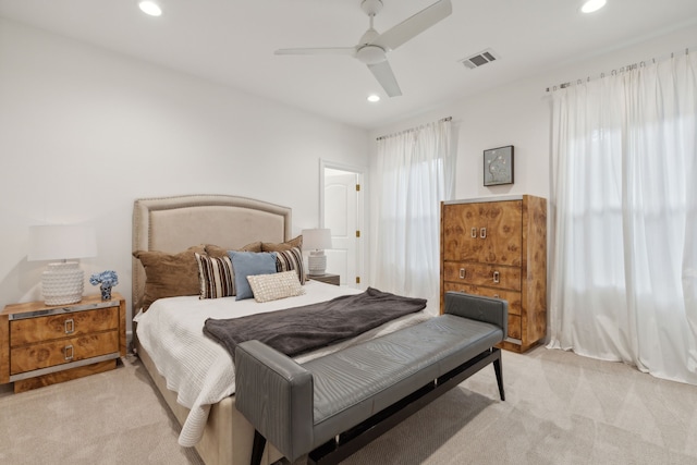 bedroom with light carpet, visible vents, ceiling fan, and recessed lighting
