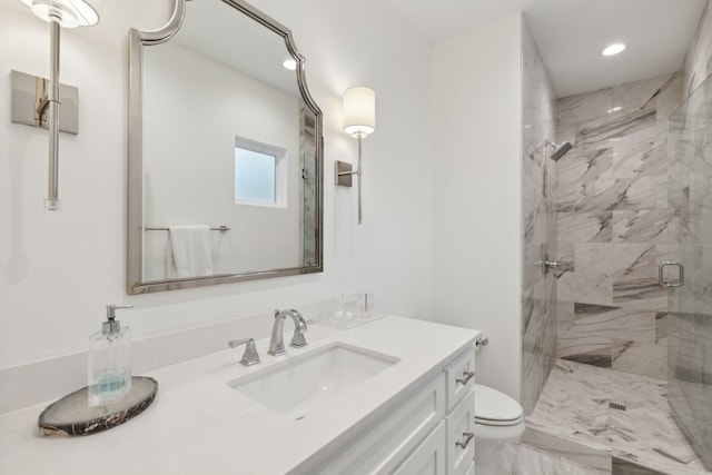 full bathroom with vanity, recessed lighting, toilet, a shower stall, and marble finish floor