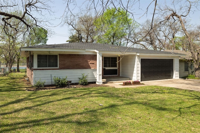 ranch-style house with fence, a front lawn, driveway, and a garage
