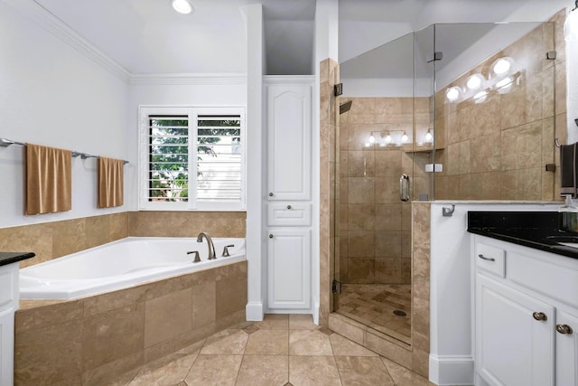 4929 Alcott St, Dallas, TX 75206 - full bath featuring a garden tub, a shower stall, vanity, ornamental molding, and tile patterned flooring