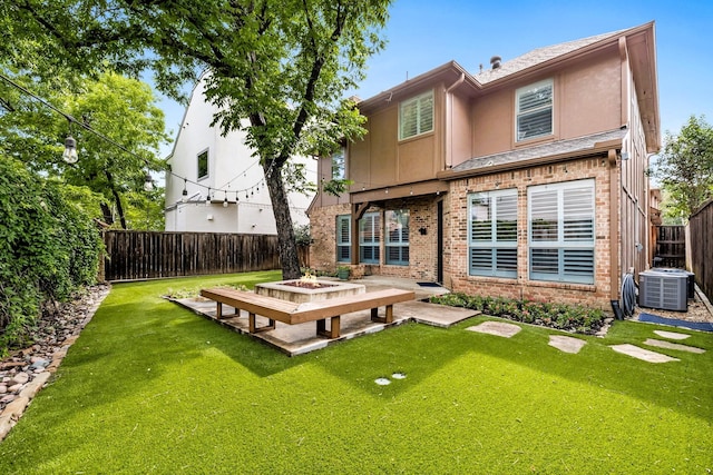 4929 Alcott St, Dallas, TX 75206 - back of house with central AC, stucco siding, brick siding, a patio, and roof with shingles