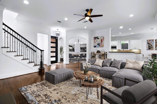 4929 Alcott St, Dallas, TX 75206 - living area with arched walkways, dark wood-type flooring, ceiling fan, recessed lighting, and crown molding