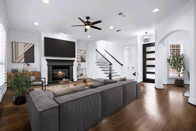 4929 Alcott St, Dallas, TX 75206 - living area featuring stairway, arched walkways, ceiling fan, wood finished floors, and recessed lighting