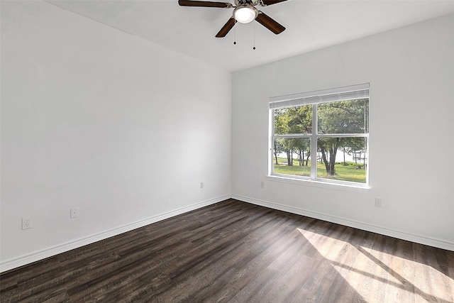 2858 Waters Edge, Quinlan, TX 75474 - unfurnished room with dark wood-type flooring, a ceiling fan, and baseboards