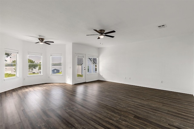 2858 Waters Edge, Quinlan, TX 75474 - unfurnished living room with dark wood-type flooring, visible vents, baseboards, and ceiling fan