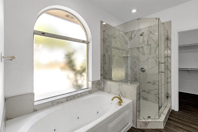 2858 Waters Edge, Quinlan, TX 75474 - full bathroom featuring a marble finish shower, recessed lighting, wood finished floors, a whirlpool tub, and a walk in closet