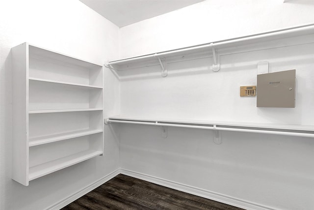 2858 Waters Edge, Quinlan, TX 75474 - spacious closet with dark wood-style flooring
