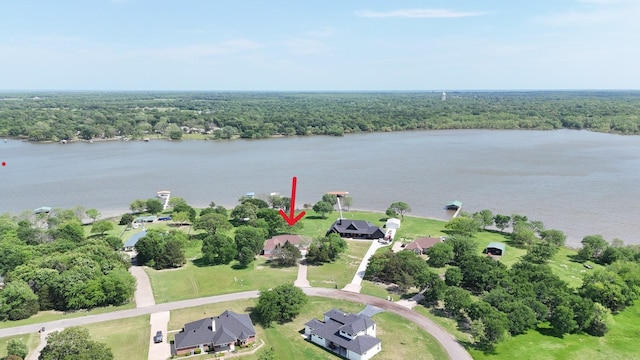 2858 Waters Edge, Quinlan, TX 75474 - drone / aerial view featuring a forest view and a water view