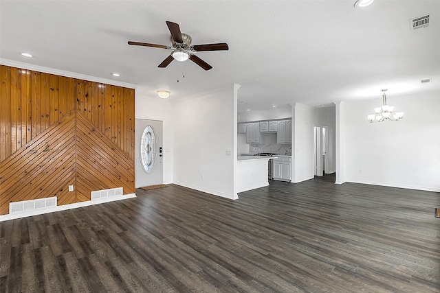 2858 Waters Edge, Quinlan, TX 75474 - unfurnished living room with baseboards, visible vents, and ceiling fan with notable chandelier