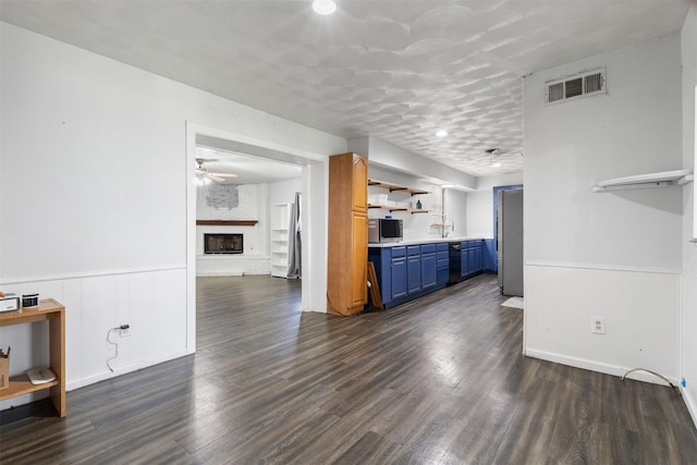 4331 Kolloch Dr, Dallas, TX 75216 - interior space featuring dark wood-type flooring, visible vents, a brick fireplace, and a sink